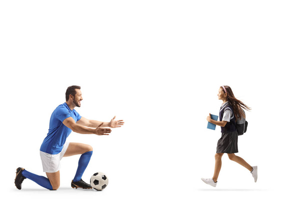 Schoolgirl running to hug a football player isolated on white backgroun - Fotó, kép