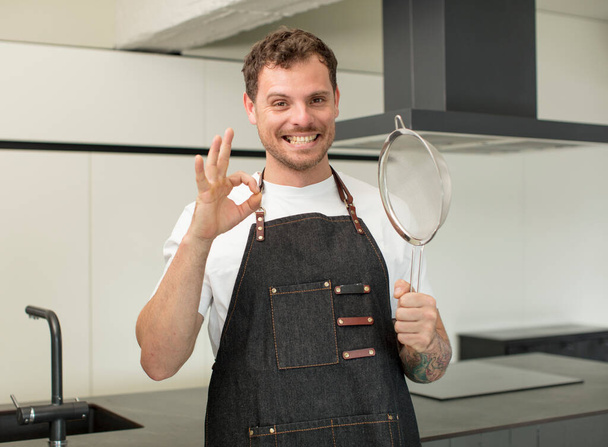 feeling happy, showing approval with okay gesture. chef at home - Fotoğraf, Görsel