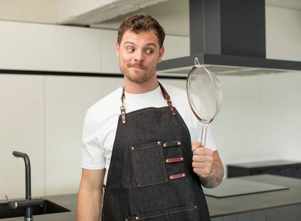 smiling and looking with a happy confident expression. chef at home - Fotoğraf, Görsel