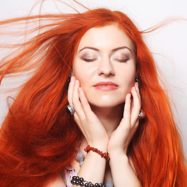 happy woman with long flowing red hair - Foto, imagen