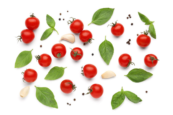 Composition with ripe cherry tomatoes and spices on white background - Fotografie, Obrázek