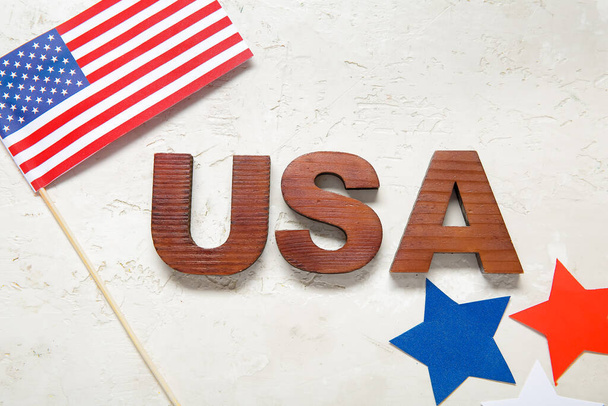 Text USA, flag and stars on grey grunge background. Independence Day celebration - Foto, Bild