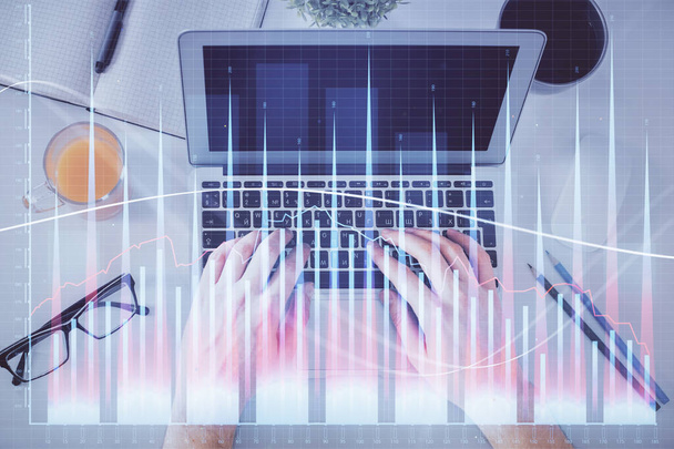 Double exposure of man's hands typing over laptop keyboard and forex chart hologram drawing. Top view. Financial markets concept. - Zdjęcie, obraz