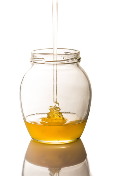 an image of jar of honey isolated on white background - Foto, afbeelding