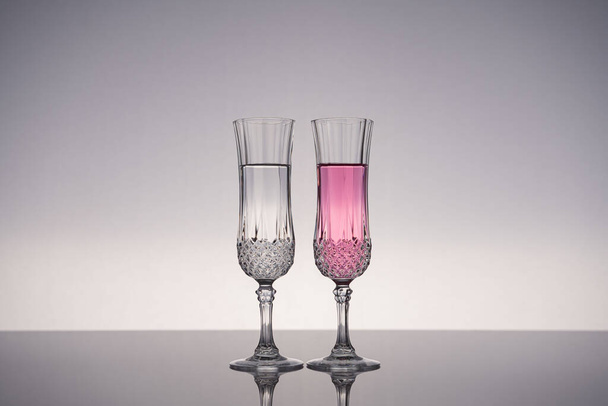 Champagne glass, champagne flute, isolated on shiny gray surface with gray background. - Foto, imagen