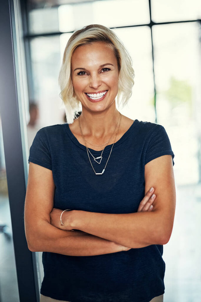 Success depends on your attitude. Portrait of a confident young businesswoman standing in an office - Fotoğraf, Görsel