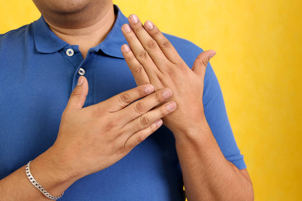 Hands of a Latino man makes sign language, expression and gesture-spatial configuration and visual perception with which deaf people establish a channel of communication - Photo, Image