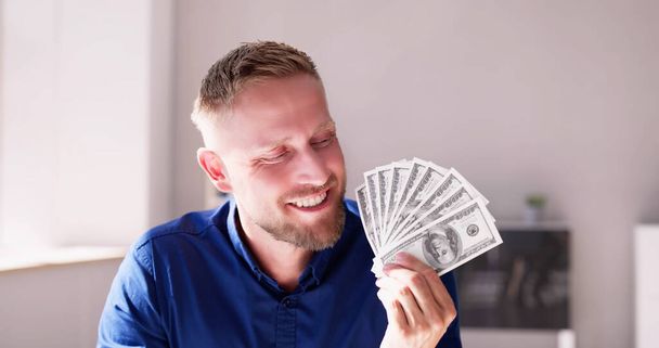 Man Holding US Dollar Paper Money Cash - Zdjęcie, obraz