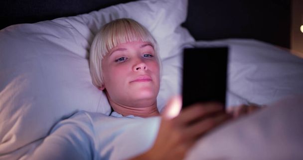 Watching Cell Phone Before Sleep At Night In Bedroom - Foto, imagen