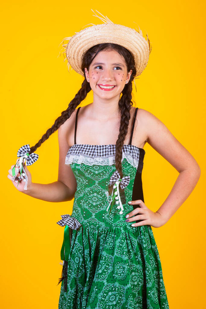 Brazilian girl, with clothes from Festa Junina, Arraial, Festa de So Joo. Vertical portrait.  - Photo, image