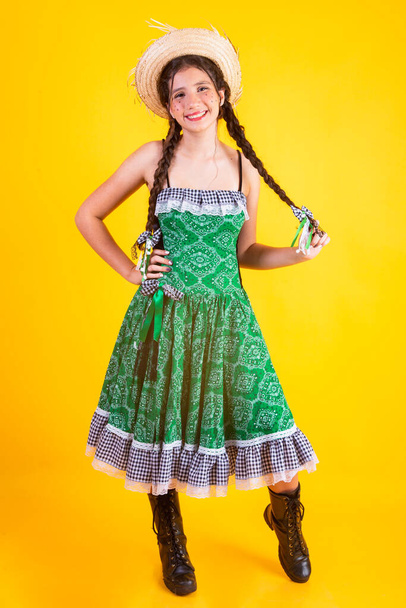 Brazilian girl, with clothes from Festa Junina, Arraial, Festa de So Joao. Vertical portrait. - 写真・画像
