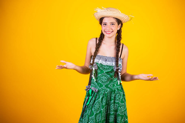 Brazilian girl, with clothes from Festa Junina, Arraial, Festa de So Joo. Horizontal portrait.  - Fotó, kép