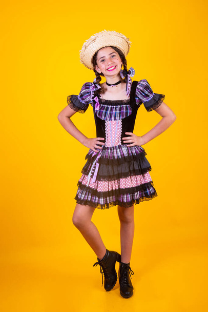 Brazilian girl, with clothes from Festa Junina, Arraial, Festa de So Joo. Horizontal portrait.  - Fotó, kép