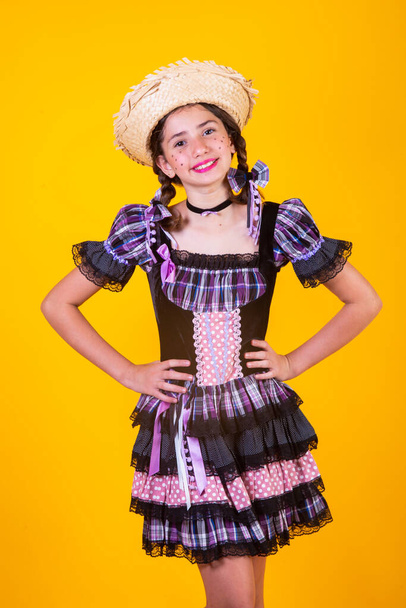 Brazilian girl, with clothes from Festa Junina, Arraial, Festa de So Joo. Horizontal portrait.  - Fotografie, Obrázek