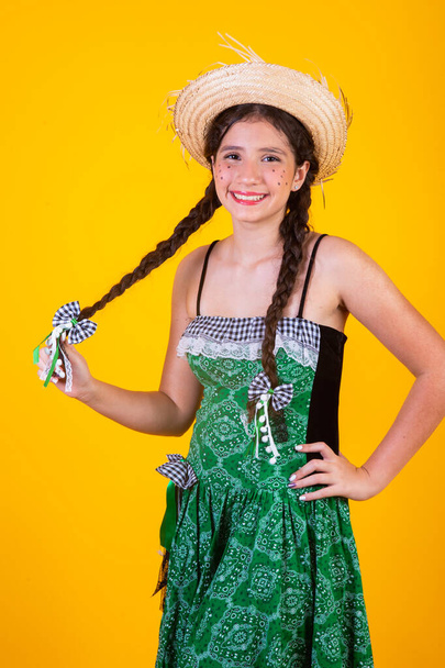 Brazilian girl, with clothes from Festa Junina, Arraial, Festa de So Joo. Horizontal portrait.  - Fotoğraf, Görsel