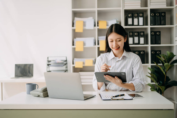 Asian businesswoman working in the office with  laptop  in modern office - Fotografie, Obrázek