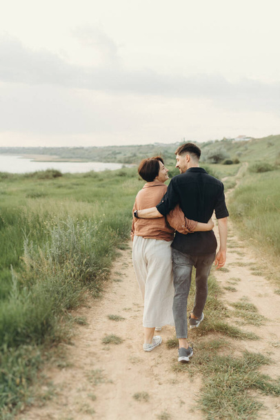 Family couple in love, husband and wife hugging outdoors, family time - Photo, image