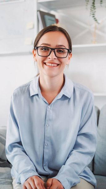 Good mood. Positive vibes. Female eyewear. Smart beautiful cheerful happy confident woman in glasses in blue shirt in white interior portrait. - Fotoğraf, Görsel