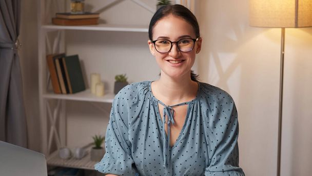 Smart woman. Expert portrait. Career success. Confident intelligent cheerful smiling female coach in glasses at modern home interior with free space. - Фото, изображение