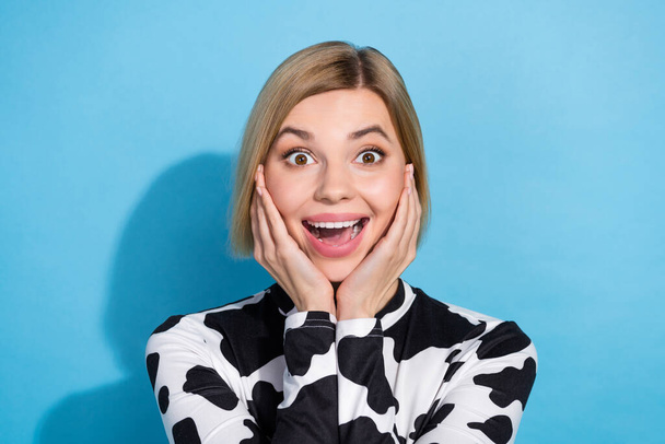 Photo of surprised funky woman bob blonde hair touch cheeks hands unbelievable high intensity sales isolated on blue color background. - Photo, Image