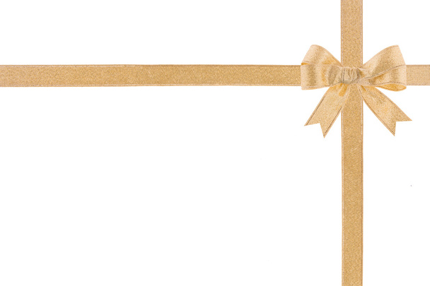 Golden ribbon with a bow on white background - Photo, Image