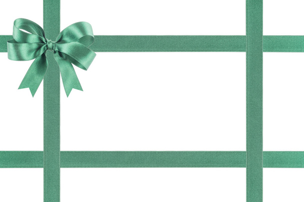 Green ribbon with a bow on white background - Photo, Image