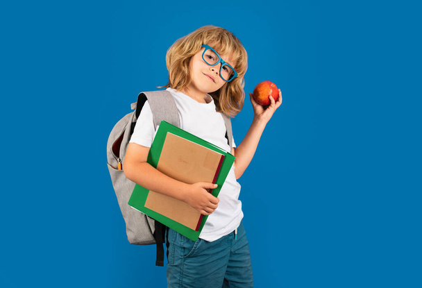 Back to school. School child with book on isolated background - Foto, Imagen