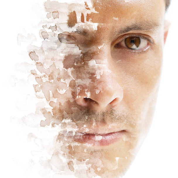 An artistic portrait of a mans face disappearing into the white background with paint splashes made in paintography technique - Photo, Image