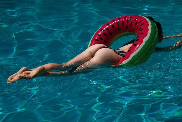 Sexy girl posing by the pool with bikini - Photo, image