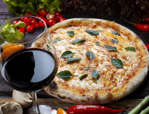 Pizza with glass of red wine - Foto, immagini
