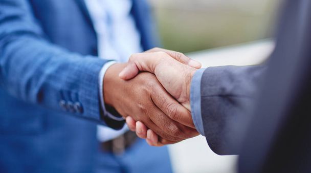 Partnership, business people and b2b handshake in support of deal, collaboration and teamwork. Men, shaking hands and welcome, thank you or congratulations gesture by professional partner negotiation. - Фото, зображення