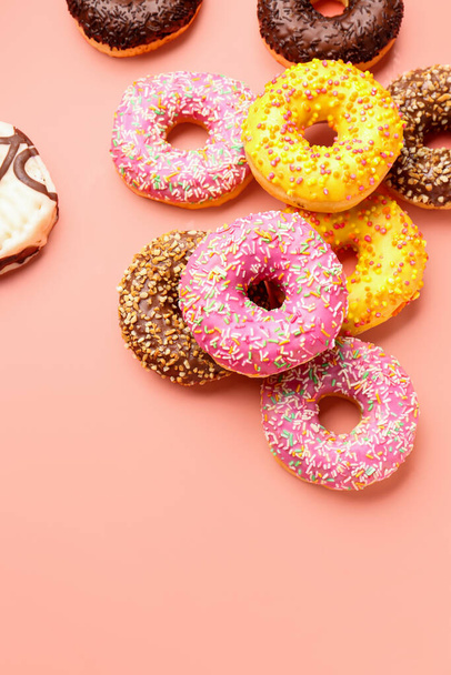 Sweet donuts on pink background - Фото, изображение
