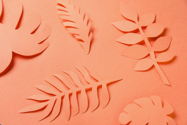 Beautiful origami leaves on orange background, closeup - Foto, immagini