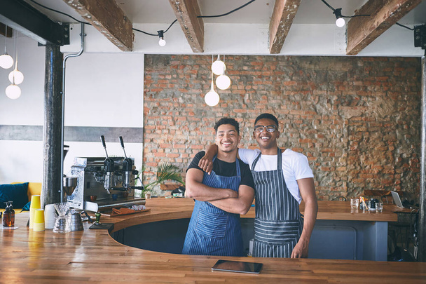 Two guys who decided to go for their dreams. two confident young men working in a cafe - Foto, Imagem