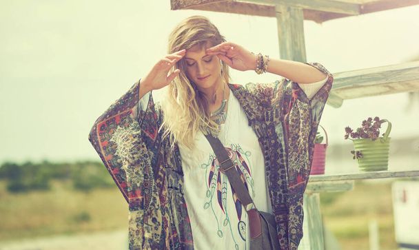 The world belongs to the wild. a bohemian young woman spending a summer day outside - Photo, image