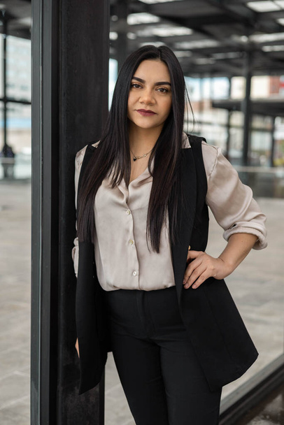 elegant outfit of young latin woman with straight hair, workplace and lifestyle of professional, business person portrait, fashion - Фото, изображение