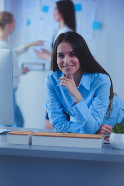 Attractive business woman working on laptop at office. Business people. - Foto, Imagem