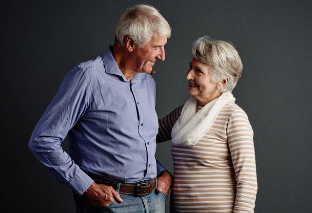 Its you and me, baby. Studio shot of an affectionate senior couple posing against a grey background - Fotoğraf, Görsel