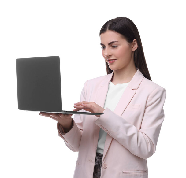 Beautiful businesswoman using laptop on white background - Фото, изображение