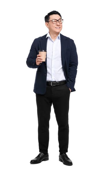Businessman in suit with cup of drink on white background - Fotó, kép