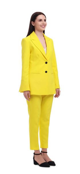 Beautiful businesswoman in yellow suit on white background - Photo, image