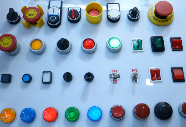Buttons, toggles, panel indicators and lights presented on stand. Industrial Exhibition. - Foto, Bild