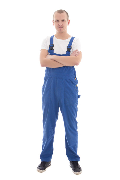 hombre guapo joven en ropa de trabajo azul aislado en blanco - Foto, imagen