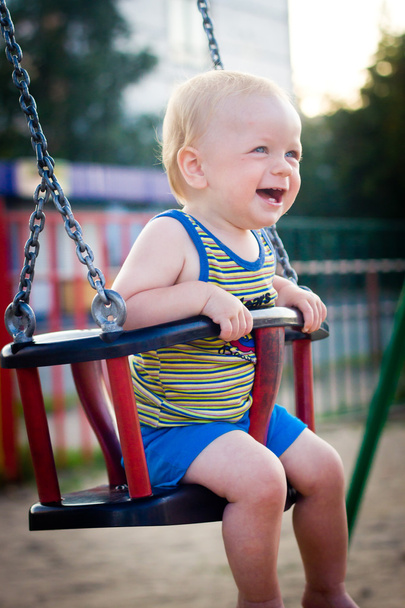 Baby in a swing - Fotó, kép