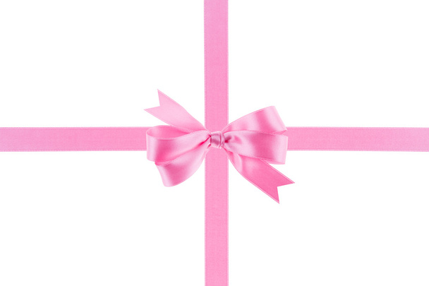 Pink ribbon with a bow on white background - Photo, Image