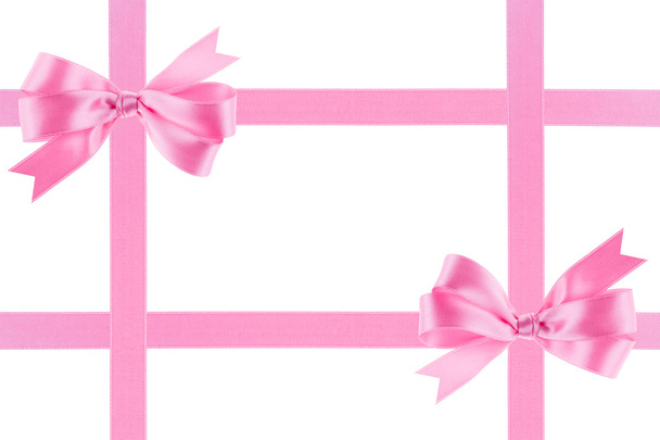 Różową wstążką z łuku na białym tle - Zdjęcie, obraz