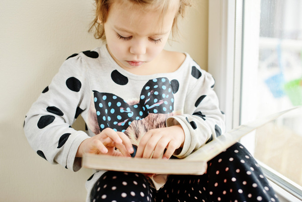 toddler with book - Photo, Image