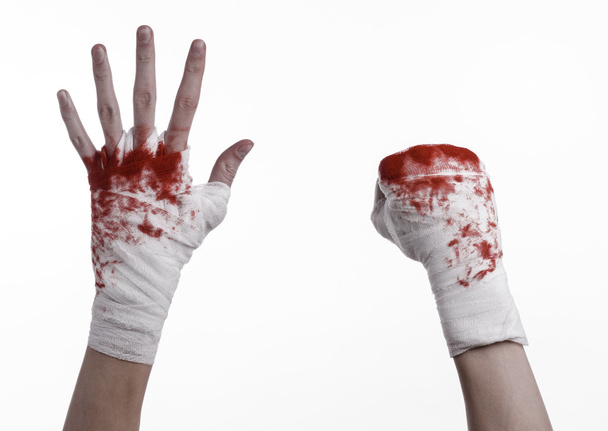 shook his bloody hand in a bandage, bloody bandage, fight club, street fight, violence, bloody theme, black background, isolated, bloody fists, boxer, tied his hands with a bandage, white background - Foto, Imagem