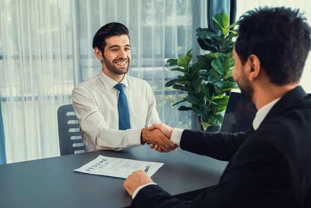 Successful job interview at business office with handshake. Positive discussion of qualifications and application for position. Job hiring concept between candidate and interviewer. Fervent - Photo, Image