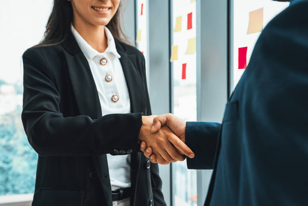Business people handshake in corporate office showing professional agreement on a financial deal contract. Jivy - Foto, Imagem